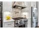 Close-up of a gourmet kitchen featuring high-end appliances and designer backsplash at 1311 Sunnys Halo Ln, Waxhaw, NC 28173