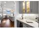 Elegant kitchen featuring gray cabinets, stainless steel appliances, and a center island, perfect for culinary enthusiasts at 1311 Sunnys Halo Ln, Waxhaw, NC 28173