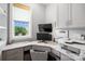 Efficient office space with a built-in desk and storage, perfect for a productive work environment at 1311 Sunnys Halo Ln, Waxhaw, NC 28173