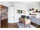 Functional home office with built-in cabinets and floating shelves, creating an organized workspace at 1311 Sunnys Halo Ln, Waxhaw, NC 28173