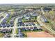Beautiful aerial view of a neighborhood with well-manicured lawns and sidewalks, showing homes and future amenities at 14015 Cameryn Elise Dr, Cornelius, NC 28031