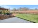 Fenced backyard with landscaping and small trees at 14015 Cameryn Elise Dr, Cornelius, NC 28031
