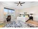 Bright bedroom with a large window, neutral decor, and a cozy seating area at 14015 Cameryn Elise Dr, Cornelius, NC 28031