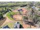 Construction underway on future neighborhood amenities with groundwork and infrastructure in progress amid a wooded landscape at 14015 Cameryn Elise Dr, Cornelius, NC 28031
