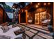 Cozy backyard patio with stylish furniture, hanging swing chairs, and lush greenery at 1505 Landis Ave, Charlotte, NC 28205
