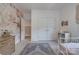 Charming bedroom with floral wallpaper accent wall, well-lit with natural light and carpeted floors at 1505 Landis Ave, Charlotte, NC 28205