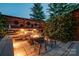 Tranquil outdoor seating area with modern fire pit, benches, and decorative lighting at 1505 Landis Ave, Charlotte, NC 28205