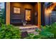 Inviting front porch with a cozy bench, charming plants, and a welcoming entryway at 1505 Landis Ave, Charlotte, NC 28205