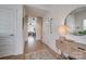 Inviting hallway with wood floors, neutral walls, and a view into the adjacent living room at 1505 Landis Ave, Charlotte, NC 28205