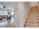 Inviting hallway view to the living area, highlighting the staircase and light hardwood floors at 1505 Landis Ave, Charlotte, NC 28205