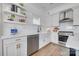 Bright kitchen featuring white cabinets, subway tile backsplash, and stainless steel appliances at 1505 Landis Ave, Charlotte, NC 28205
