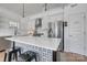 Modern kitchen with island, quartz countertops, stainless steel appliances, and a walk-in pantry at 1505 Landis Ave, Charlotte, NC 28205