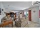 Spacious living room with fireplace, built-in shelves, hardwood floors and natural light at 15101 Sharrow Bay Ct # 12, Huntersville, NC 28078