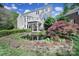 Backyard view of a landscaped yard with a koi pond and a deck at 15101 Sharrow Bay Ct # 12, Huntersville, NC 28078