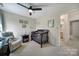 Bright Bedroom featuring a crib, comfortable armchair, and ample natural light at 15101 Sharrow Bay Ct # 12, Huntersville, NC 28078