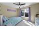 Cozy bedroom with carpet, ceiling fan, and window providing natural light at 15101 Sharrow Bay Ct # 12, Huntersville, NC 28078