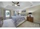 Bright and airy bedroom with a tray ceiling, plush carpet, and large windows at 15101 Sharrow Bay Ct # 12, Huntersville, NC 28078