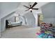 Expansive bonus room featuring a bed, playspace and ample natural light at 15101 Sharrow Bay Ct # 12, Huntersville, NC 28078