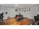 Functional exercise room with hardwood floors, ample space, and exercise equipment at 15101 Sharrow Bay Ct # 12, Huntersville, NC 28078