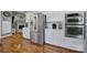 Kitchen featuring stainless steel appliances, white cabinets, and a view of the dining area at 15101 Sharrow Bay Ct # 12, Huntersville, NC 28078