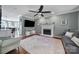 Cozy living room featuring a fireplace, neutral paint colors, and a large window for natural light at 15101 Sharrow Bay Ct # 12, Huntersville, NC 28078