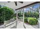 Covered patio with a wooden swing and scenic views of the backyard at 15101 Sharrow Bay Ct # 12, Huntersville, NC 28078