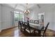 Elegant dining room with a large table, chandelier, and coffered ceiling at 15101 Sharrow Bay Ct # 12, Huntersville, NC 28078