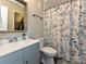 The bathroom features a modern vanity and a shower/tub combination with a decorative shower curtain at 1615 Merry Oaks Rd # G, Charlotte, NC 28205