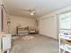 Bright Bedroom with a crib, rocking chair, and neutral walls, perfect for a growing Gathering at 1615 Merry Oaks Rd # G, Charlotte, NC 28205