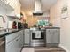 Updated kitchen featuring stainless steel appliances, white subway tile, and modern finishes at 1615 Merry Oaks Rd # G, Charlotte, NC 28205