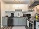 Modern kitchen features stainless steel appliances, granite countertops, and subway tile backsplash at 1615 Merry Oaks Rd # G, Charlotte, NC 28205