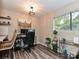 Home office featuring a large window, hardwood floors, and a modern desk setup at 1615 Merry Oaks Rd # G, Charlotte, NC 28205