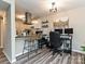 Home office space with a desk and chair located in a kitchen/living area with modern décor at 1615 Merry Oaks Rd # G, Charlotte, NC 28205