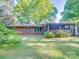 Lush backyard features a screen porch and well-maintained lawn, perfect for outdoor activities at 1881 Sharonwood Ln, Rock Hill, SC 29732