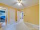 Bright bedroom with a connecting bathroom and closet doors at 1881 Sharonwood Ln, Rock Hill, SC 29732