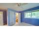 Blue bedroom with a window and door leading to a bathroom at 1881 Sharonwood Ln, Rock Hill, SC 29732