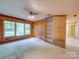 Spacious bedroom with wood paneled walls, built-in shelving, and natural light at 1881 Sharonwood Ln, Rock Hill, SC 29732