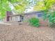 Quaint single story brick home with mature trees adding shade and character to the property at 1881 Sharonwood Ln, Rock Hill, SC 29732