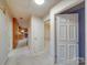 Traditional-style hallway with white doors, cream carpet, and access to other rooms in the house at 1881 Sharonwood Ln, Rock Hill, SC 29732