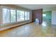 Spacious living room features hardwood floors and a brick fireplace, bathed in natural light at 1881 Sharonwood Ln, Rock Hill, SC 29732