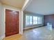 Living room features hardwood floors and large window offering bright, natural light at 1881 Sharonwood Ln, Rock Hill, SC 29732