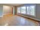 Bright living room features hardwood floors, large windows with natural light, and neutral paint at 1881 Sharonwood Ln, Rock Hill, SC 29732