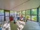 Enclosed screen porch with plentiful light to create an ideal space for enjoying nature indoors at 1881 Sharonwood Ln, Rock Hill, SC 29732