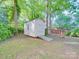 Well-kept backyard shed with ramp access, ideal for storage or hobbies in a private setting at 1881 Sharonwood Ln, Rock Hill, SC 29732