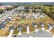 Aerial view of neighborhood featuring modern homes, green lawns and wooded areas at 1976 Ethan Ln, Stanfield, NC 28163