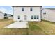 The backyard has a patio, lawn, and the home's exterior is light vinyl siding at 1976 Ethan Ln, Stanfield, NC 28163