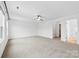 Spacious bedroom features neutral carpet and multiple entryways to bathroom and closet at 1976 Ethan Ln, Stanfield, NC 28163