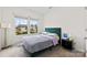Bedroom with a teal headboard, modern bedside table, and natural light from a double window at 1976 Ethan Ln, Stanfield, NC 28163