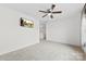 Spacious bedroom with carpet, a ceiling fan with lights, and a mounted television at 1976 Ethan Ln, Stanfield, NC 28163