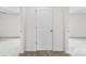 Neutral hallway featuring carpeted floors and a closed white door between two rooms at 1976 Ethan Ln, Stanfield, NC 28163